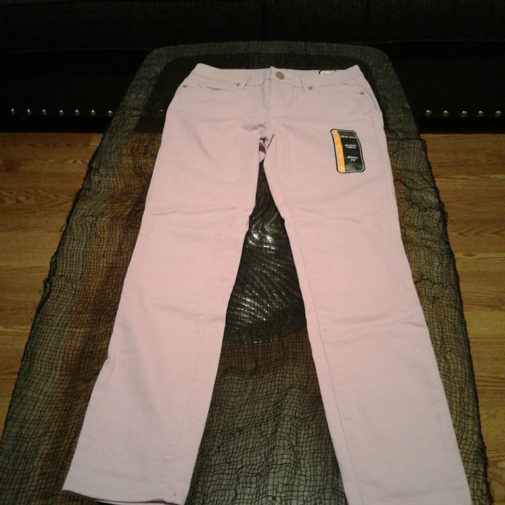 A pair of purple low rise skinny jeans